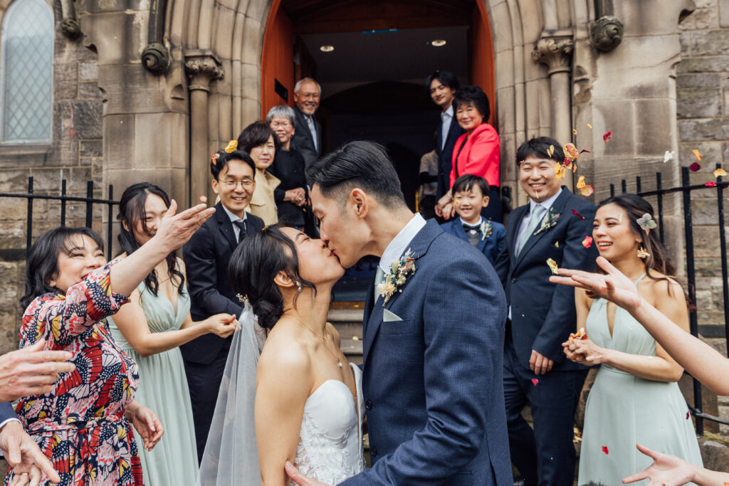 Bride and groom's confetti exit after their Edinburgh wedding 