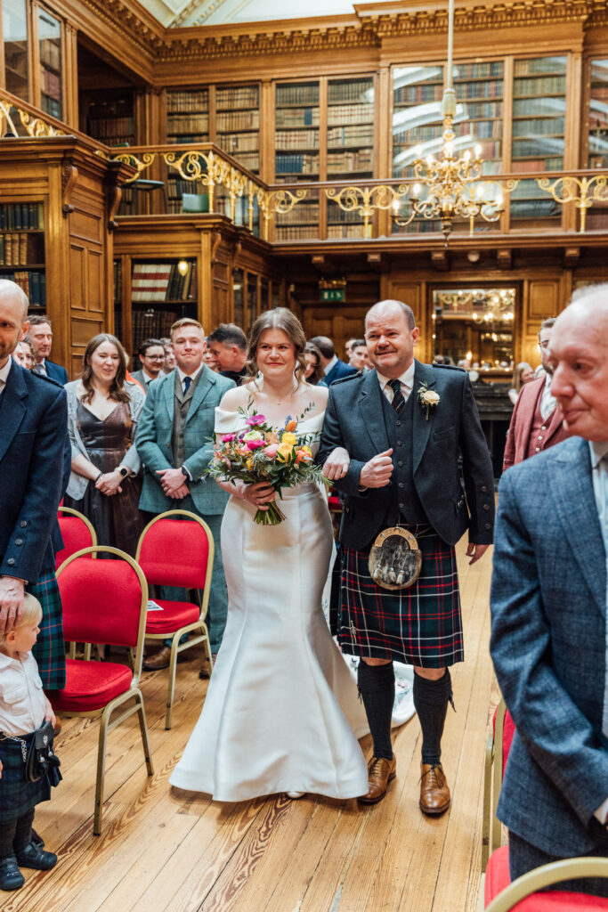 A father walks a bride down the aisle at Royal College of Physicians Edinburgh