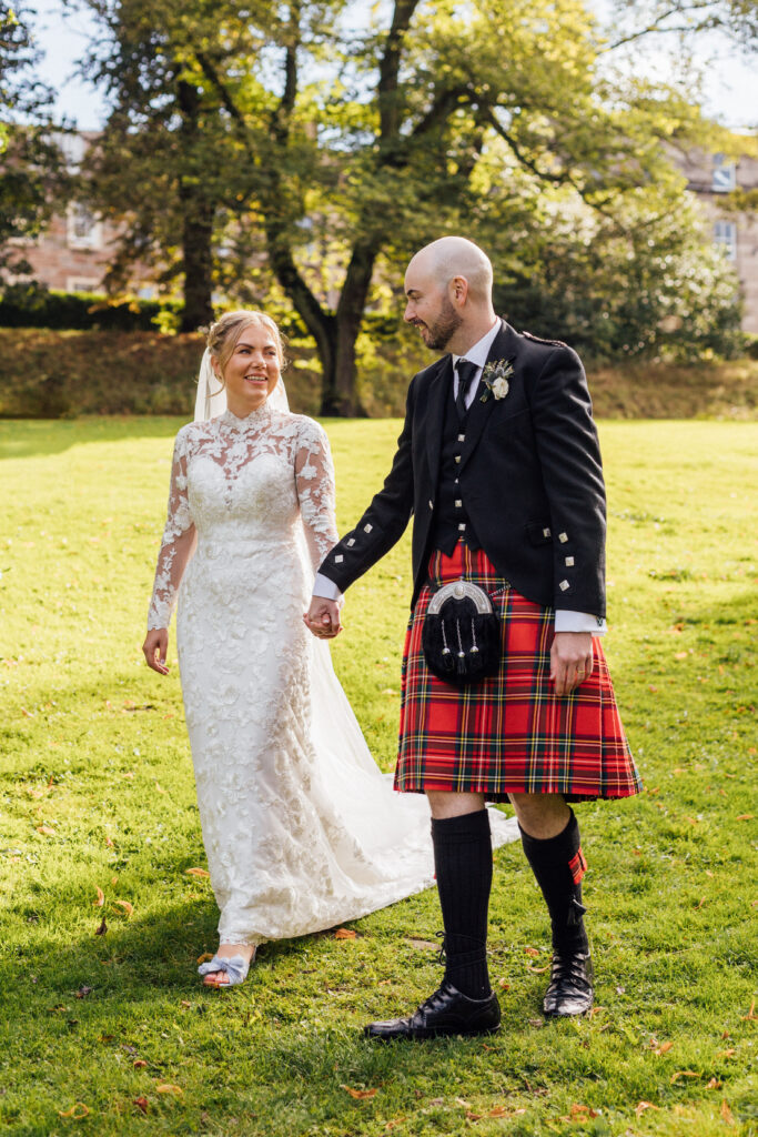 Bride and groom go for a stroll at Queen Street Gardens